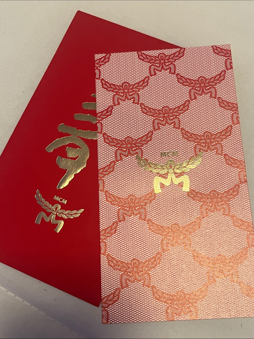 MCM Red & Pink Logo Pattern Card with Gold Foil Emblem